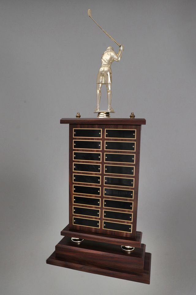 Back View of A large Golf Perpetual Trophy by Schoppy's. The trophy features a Large 8 inch Golfer Figure in a swinging position and comes with decorative acorn trim. The front of the base displays a large black laser-engraved heading plate, accompanied by 12 smaller individual plates for recording past winners. The back includes 18 smaller individual plates for recording past winners.
