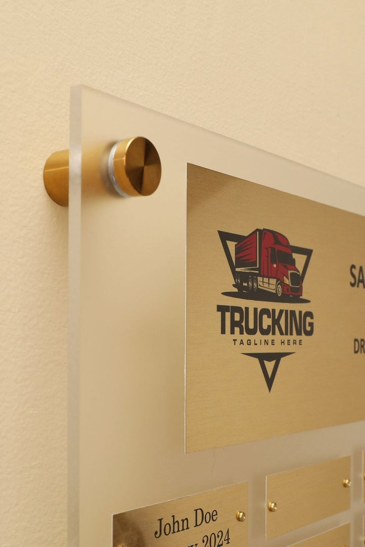 Close up of 23 by 23 inch frosted acrylic perpetual plaque with  Individual Gold Aluminum engraving plates 