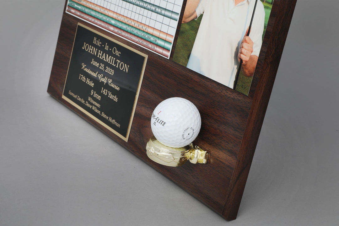 A golf ball attached to a wooden plaque
