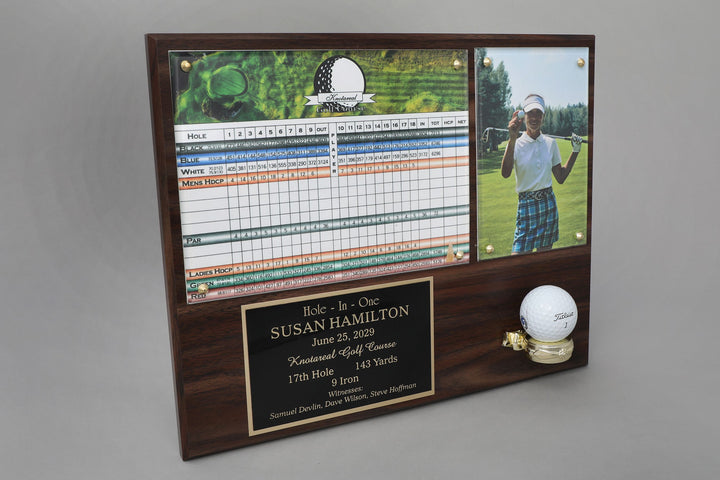 A wooden plaque featuring a photo of a golfer, a golf scorecard, and a engraved plate with text recognizing a hole in one achievement.