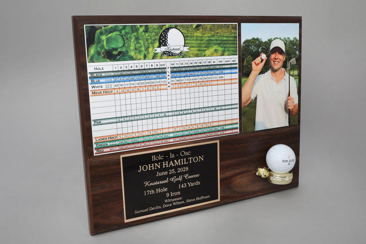 A wooden plaque featuring a photo of a golfer, a golf scorecard, and a engraved plate with text recognizing a hole in one achievement.