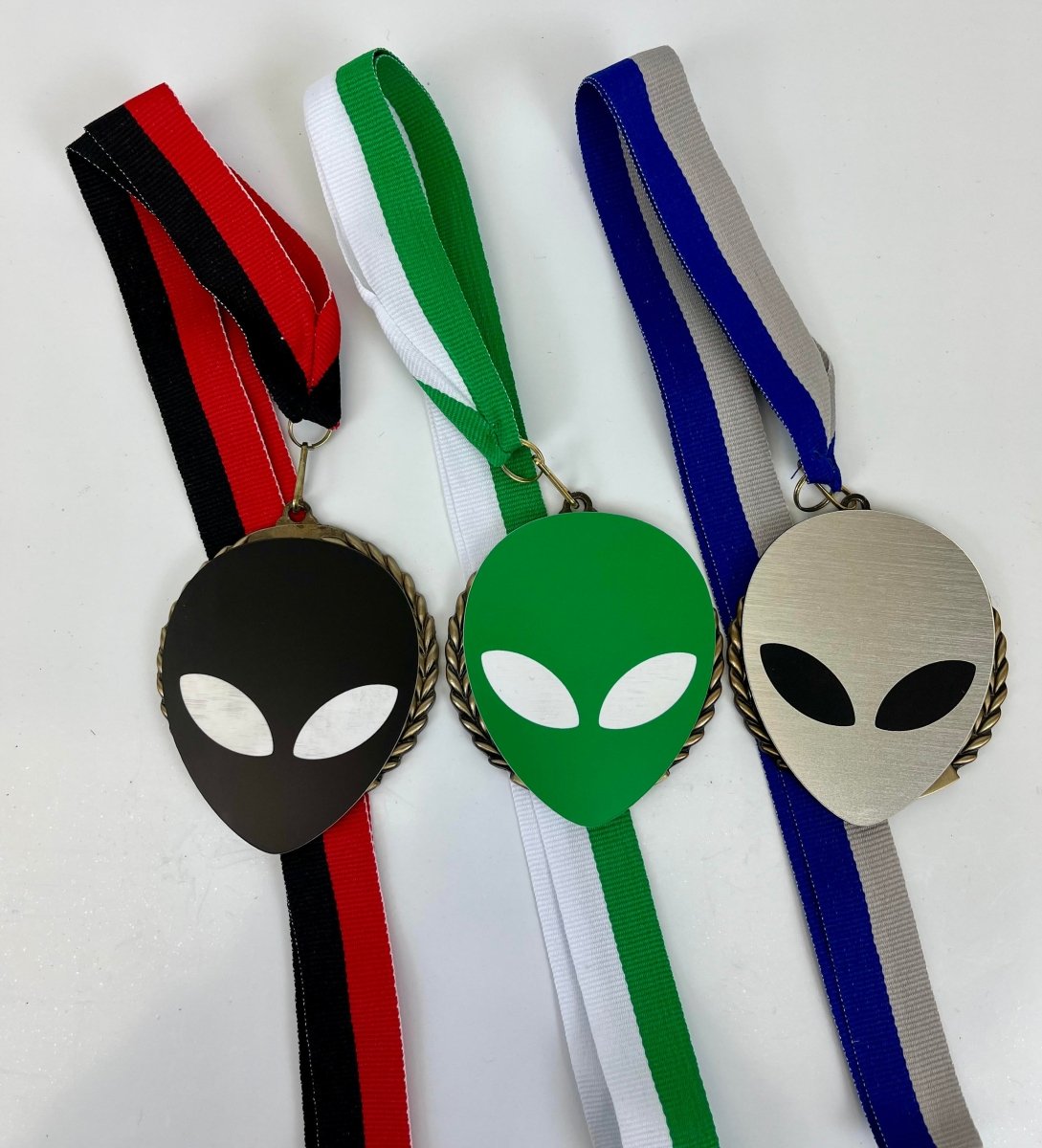 Alien Vector Cut Logo Medal - Schoppy's Since 1921