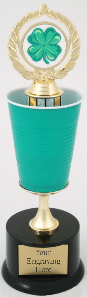 A trophy cup with a ribbed teal green body, a gold-plated wreath and shamrock emblem on top, a gold stem, and a black base featuring a customizable gold plaque that reads &