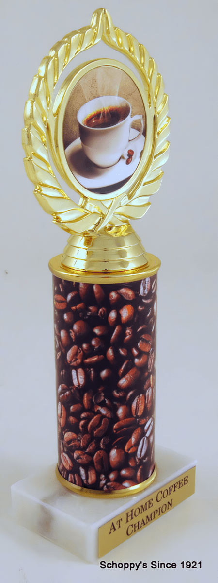 A coffee-themed trophy with a gold laurel wreath top featuring a coffee cup photo, a cylindrical column filled with coffee beans, and a white marble base with a gold plaque.