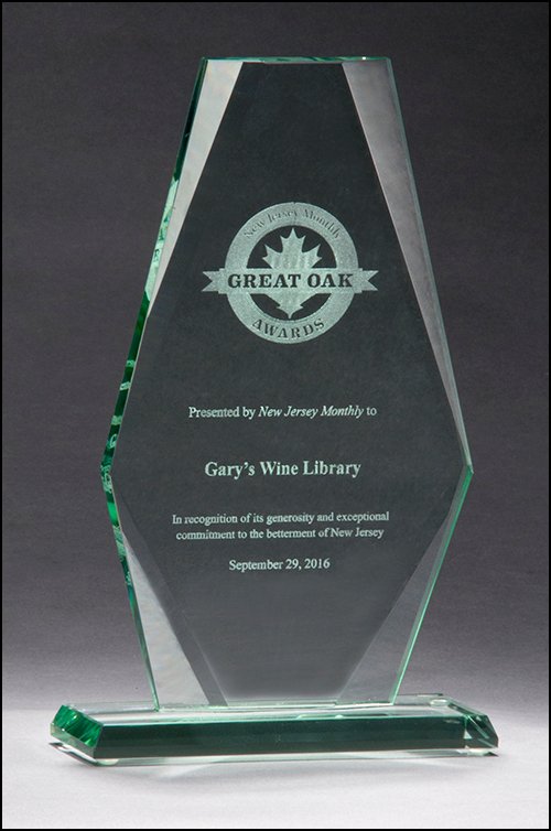 Premium Series Jade Glass Award featuring a half-inch thick, jade-tinted glass body in a flat-topped arrow shape, mounted on a base